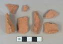 Red brick fragments; redware vessel body fragments, dark brown lead glaze