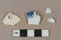 Blue on white pearlware vessel body and rim fragments, white paste, 2 fragments shell-edged