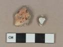 Heavily burned bone fragment; clinker/coal ash fragment