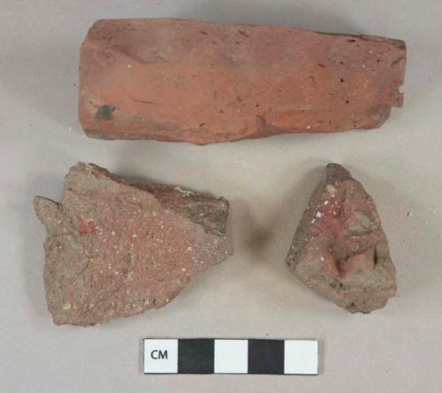 Dark red brick fragments