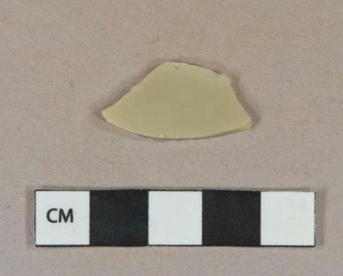 Tan opaque glass vessel body fragment