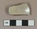 White tin glazed earthenware vessel body fragment, dark brown paste, likely Faience