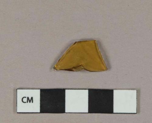 Yellow glass vessel body fragment