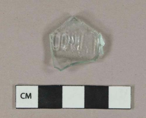 Aqua glass vessel body fragment, molded letters "[...]ON,"