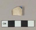 Blue on white decorated pearlware vessel rim fragment, white paste, possible shell-edge