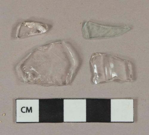 3 colorless and 1 light aqua vessel glass body fragments