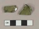 Olive green vessel glass body fragments, likely bottle