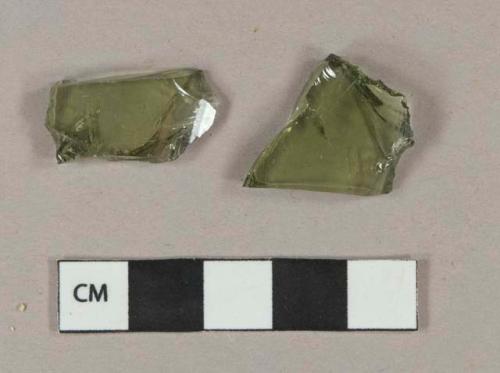 Olive green vessel glass body fragments, likely bottle