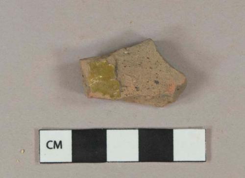 Dark brown and green lead glazed redware vessel body fragment