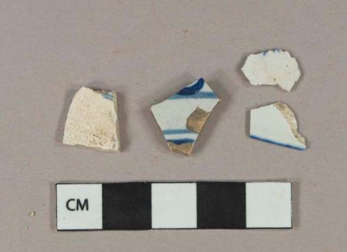 Blue on white decorated pearlware vessel body and rim fragments, light buff paste; Blue on white handpainted tin-glazed earthenware vessel body fragment, buff paste