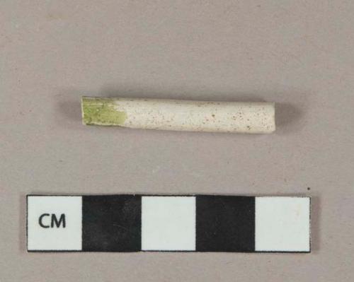 White kaolin pipe stem fragment with green lead glaze at one end, 5/64" bore diameter
