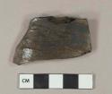 Dark olive green vessel body fragment, likely bottle