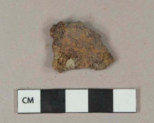 Unidentified flat ferrous metal fragment, heavily corroded