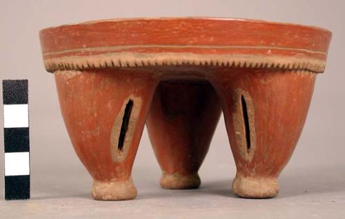 Pottery tripod dish with rattle legs - reddish brown slip; height 7 cm