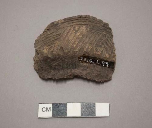 Rim sherd, incised designs on exterior