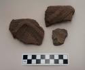 Ceramic body sherds, raised, punctate, and incised designs on exterior