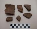 Ceramic rim sherds, incised parallel linear designs, one sherd mended