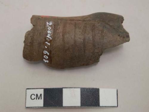 Ceramic pipe fragment, incised cross-hatch and parallel designs
