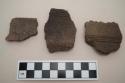 Ceramic rim or body sherds, incised, punctate and designs in relief