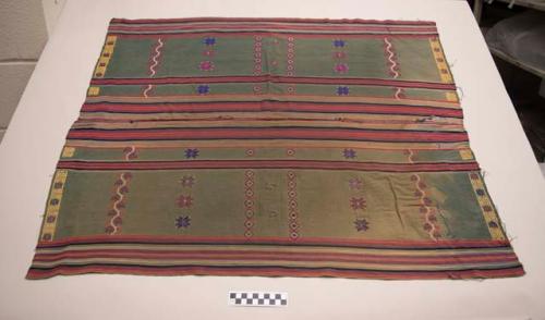 Piece of cotton textile (31" x 36"), green with multi-colored stripes and embroi