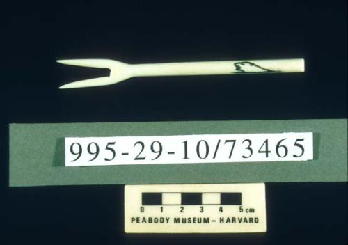 Carved ivory scrimshaw cocktail fork with seal motif