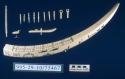 Ivory cribbage board (A) with decorations (B-F) and playing pieces (G)