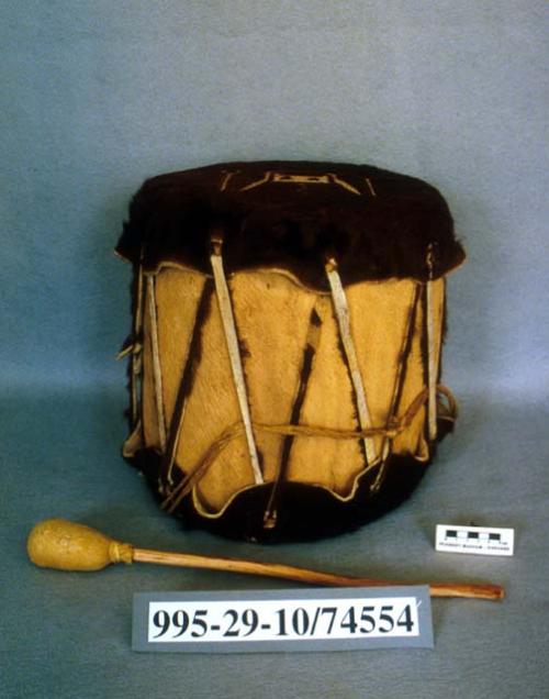 Large wooden drum (A) with beater (B)