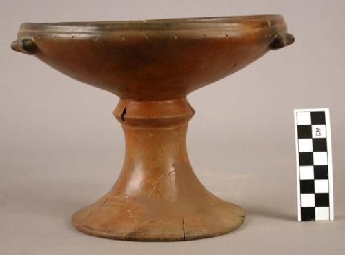 Restored pedestal-base pottery vessel