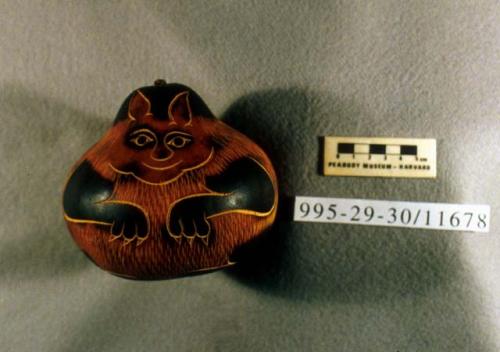 Carved and incised gourd depicting a cat