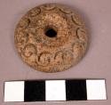 Ornamented pottery spindle whorl