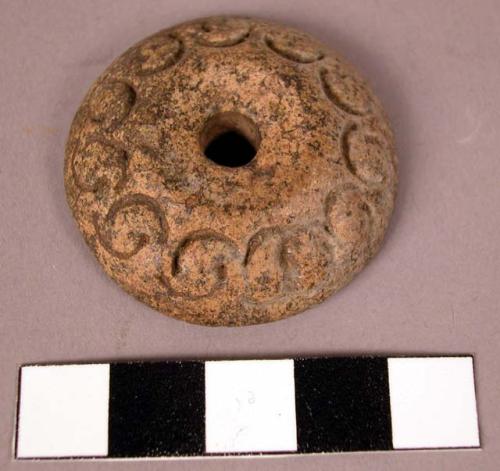 Ornamented pottery spindle whorl