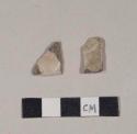 Glazed unidentified refined earthenware body sherds; two sherds crossmend