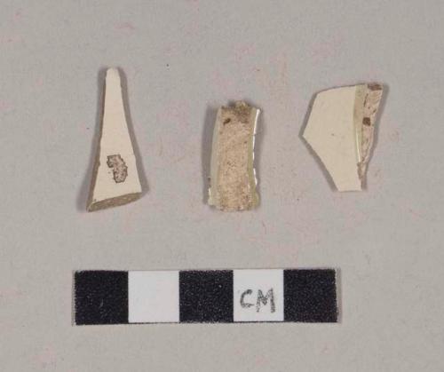 Undecorated creamware body sherds; two sherds crossmend