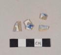 Blue transfer printed whiteware body sherds; three sherds crossmend