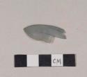 Curved translucent blue plastic fragment