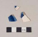 Flow blue pearlware body sherds; three sherds crossmend