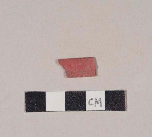 Red plastic fragment