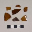 Glass, amber bottle glass fragments; several have mold seams