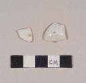 Undecorated porcelain base sherds; two sherds crossmend; one with possible blue makers mark on base