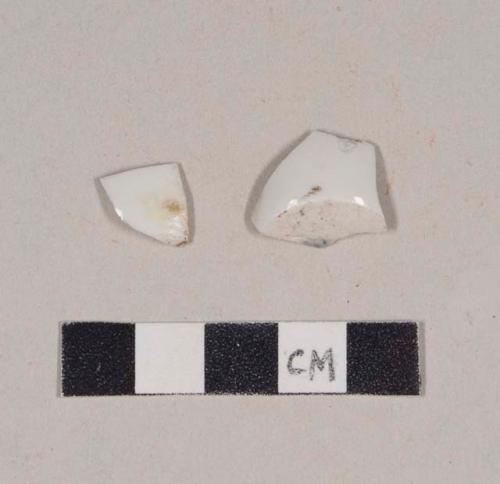 Undecorated porcelain base sherds; two sherds crossmend; one with possible blue makers mark on base