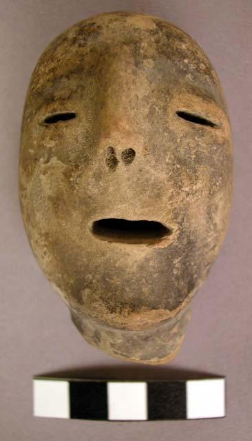 Crude pottery figurine head