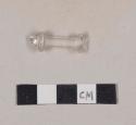 Molded colorless glass object fragment, likely a fragment of a syringe plunger