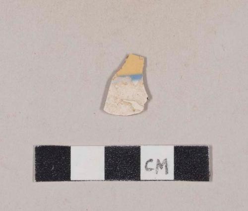 Blue and white slip decorated yellow ware body sherd