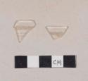 Curved colorless glass rim fragments with etched design; two fragments crossmend with etched body fragment (987-22-10/105583)