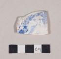 Molded, blue transfer printed whiteware rim sherd