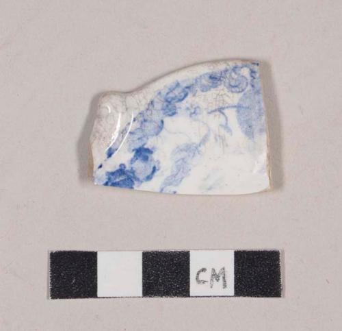 Molded, blue transfer printed whiteware rim sherd