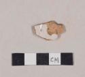 Undecorated red-bodied tin glaze earthenware body sherd