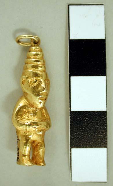 Small male figurine with hat; gold pendant with double ring on top