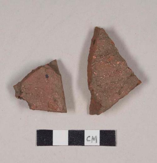 Redware roof tile fragments, one has part of nail hole