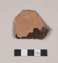 Undecorated lead glazed redware base sherd